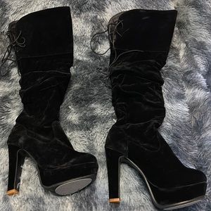 Black velvet over the knee platform boots.